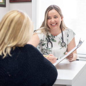 Naturopathic doctor discussing thyroid health, bloodwork and treatment options with a patient at Hudson Integrative Healthcare.