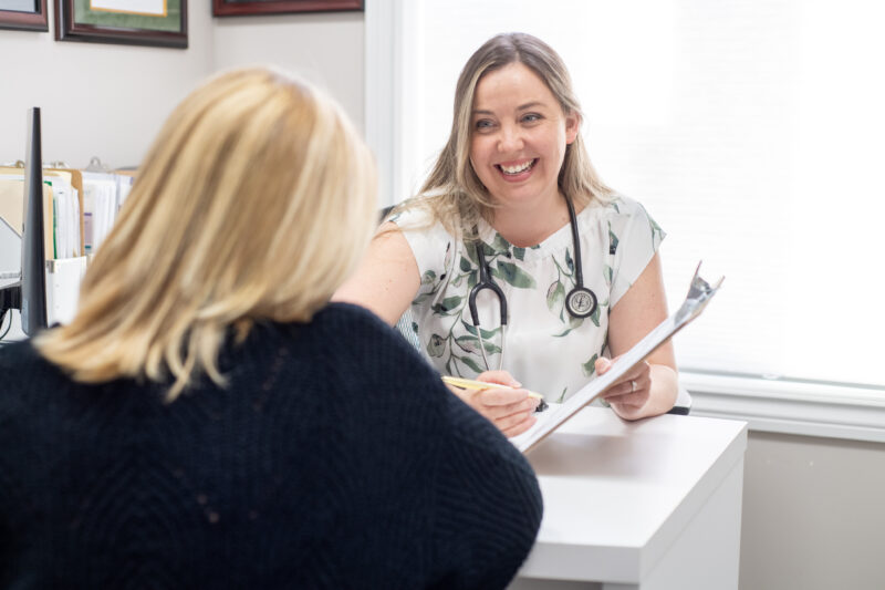 Naturopathic doctor discussing thyroid health, bloodwork and treatment options with a patient at Hudson Integrative Healthcare.