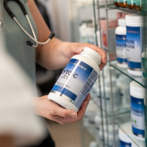 Naturopathic doctor reviewing professional nutritional supplements at Hudson Integrative Healthcare