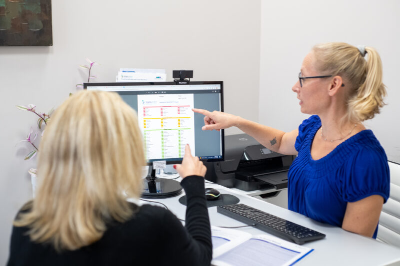 Naturopathic doctor reviewing a patient chart and ordering laboratory testing at Hudson Integrative Healthcare
