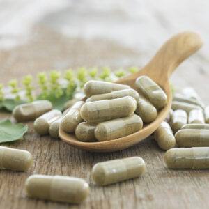 Herbal supplement capsules representing natural support options for perimenopause symptoms and hormone health.