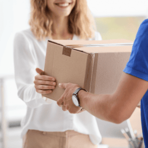 Woman receiving a package of supplements delivered directly to her home.